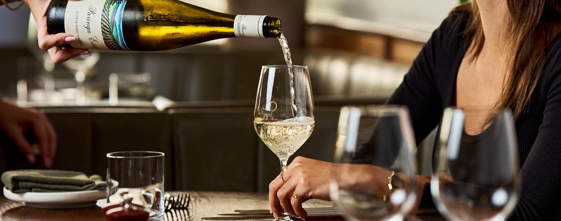 Wine being poured at Social Dining