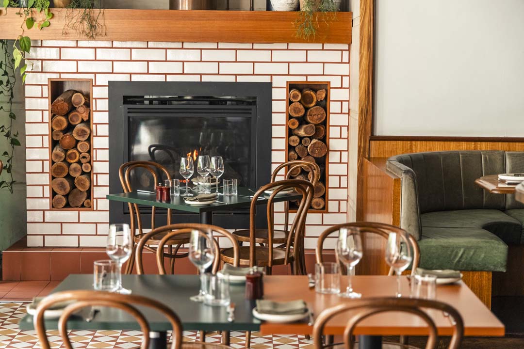 Private dining table by the fireplace at Social Dining